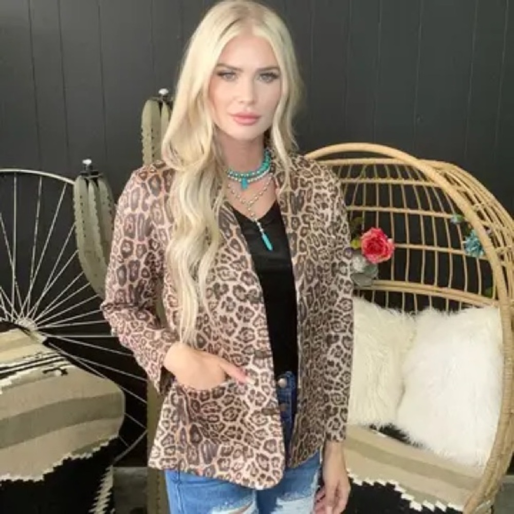 NWOT- ANIMAL PRINT BLAZER never been worn- tag is a S but fits more like a M